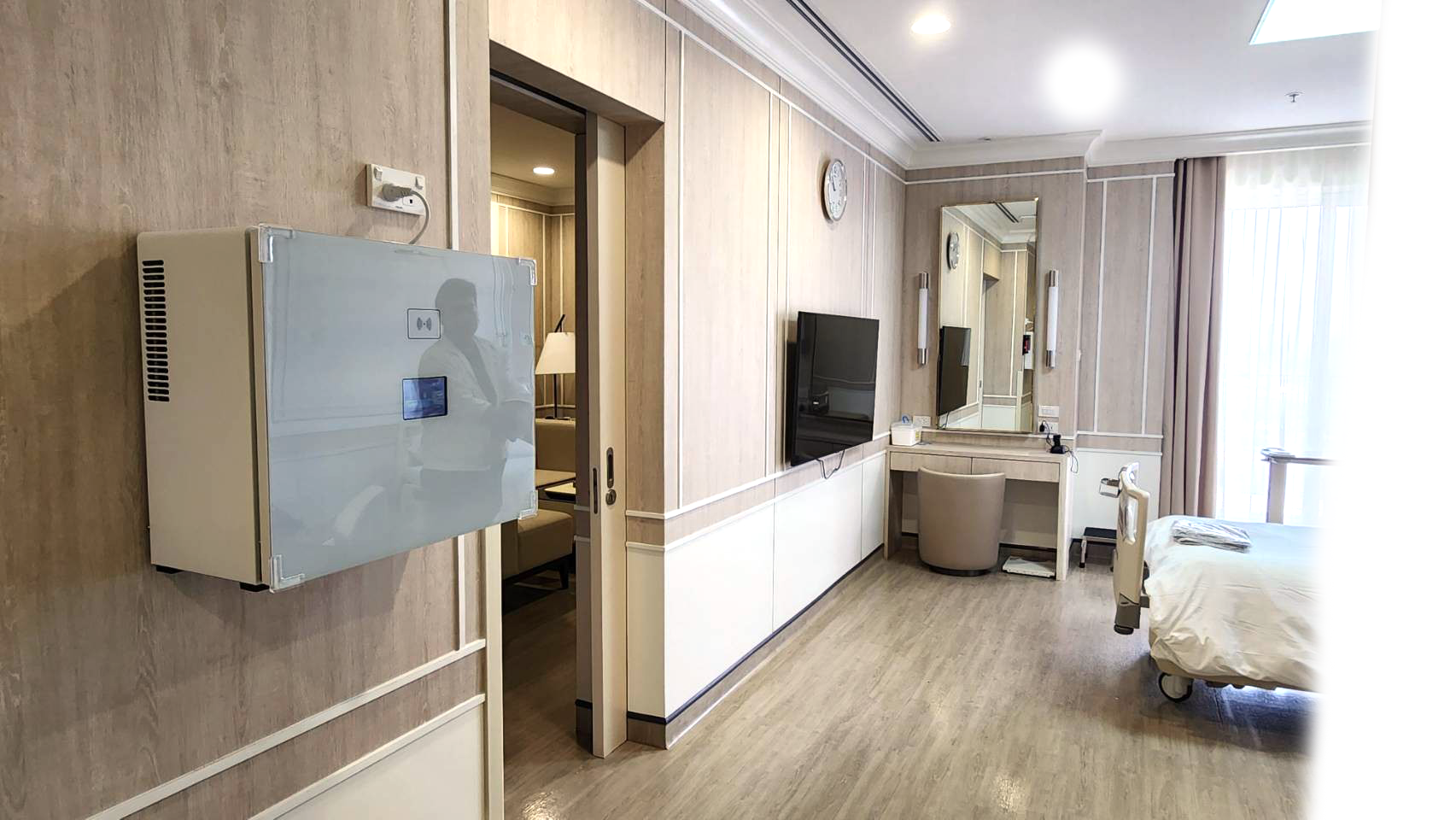 HapyMed IPD smart drug cabinet mounted on the wall in a modern hospital room