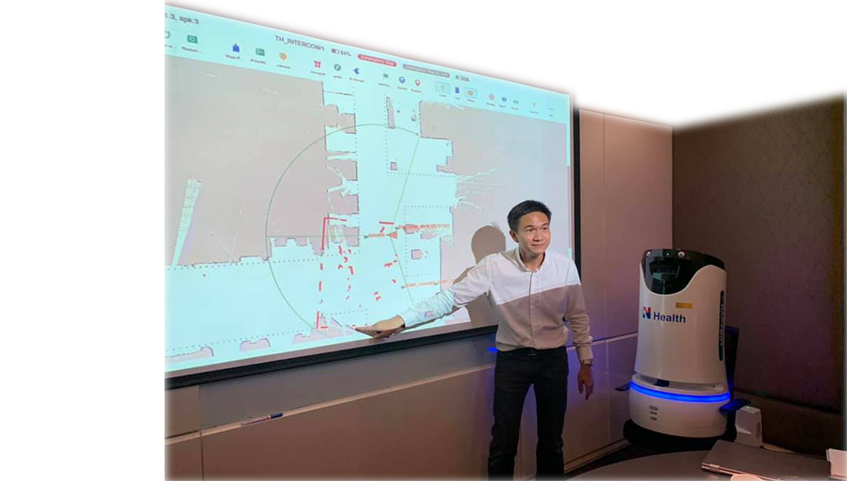 A healthcare professional conducting a training session with an autonomous medical robot, demonstrating innovative healthcare solutions.