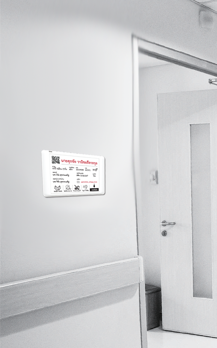 E-Ink room signage in a hospital corridor showing room number and doctor information by HAPYsign
