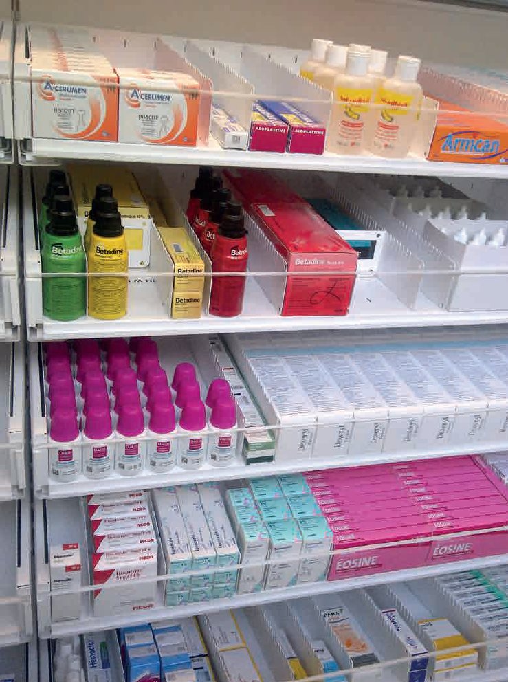 Modern pharmacy shelving system in hospital with sliding drawers